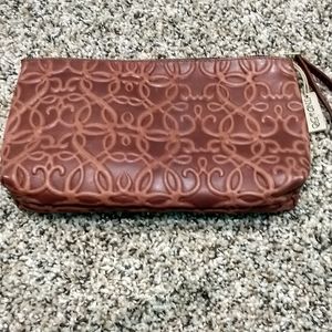 Brown embossed leather jewelry pouch
